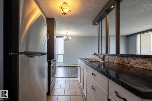 911 10883 Saskatchewan Drive, Edmonton, AB - Indoor Photo Showing Kitchen With Double Sink