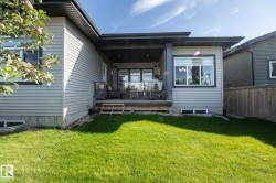 Back of property featuring a wooden deck - 