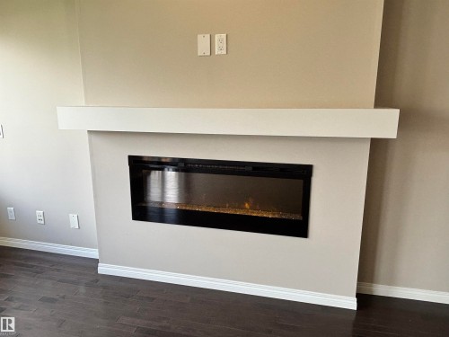 2317 76 Street, Edmonton, AB - Indoor Photo Showing Living Room With Fireplace