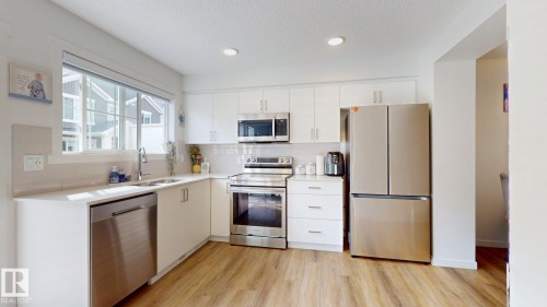 64 1110 Daniels Link Link, Edmonton, AB - Indoor Photo Showing Kitchen With Double Sink