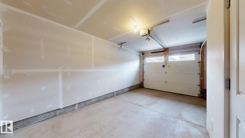 64 1110 Daniels Link Link, Edmonton, AB - Indoor Photo Showing Garage