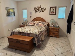Bedroom featuring light tile patterned flooring - 