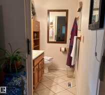 Bathroom featuring tile patterned flooring and vanity - 