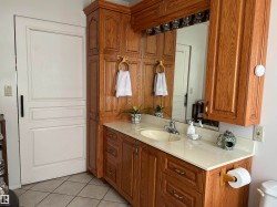 Bathroom with vanity and tile patterned flooring - 