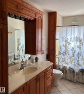 Full bathroom with vanity, a textured ceiling, tile patterned flooring, and curtained shower - 