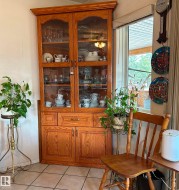 Bar area with light tile patterned floors and a textured ceiling - 