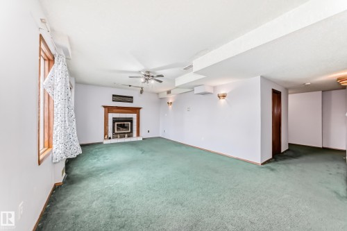 1068 James Crescent, Edmonton, AB - Indoor Photo Showing Other Room With Fireplace