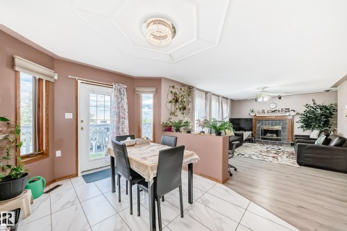 1068 James Crescent, Edmonton, AB - Indoor Photo Showing Dining Room With Fireplace