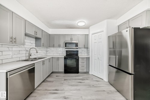 13116 31 Strret, Edmonton, AB - Indoor Photo Showing Kitchen With Stainless Steel Kitchen With Double Sink