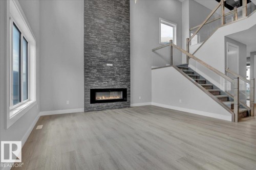 65 Blackbird Bend, Fort Saskatchewan, AB - Indoor Photo Showing Living Room With Fireplace