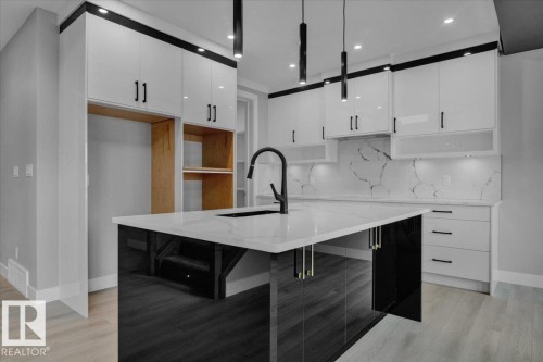 65 Blackbird Bend, Fort Saskatchewan, AB - Indoor Photo Showing Kitchen With Upgraded Kitchen