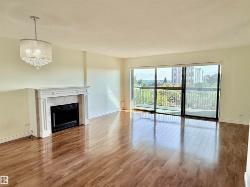 604 11027 87 Avenue, Edmonton, AB - Indoor Photo Showing Living Room With Fireplace