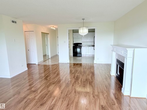 604 11027 87 Avenue, Edmonton, AB - Indoor Photo Showing Living Room With Fireplace