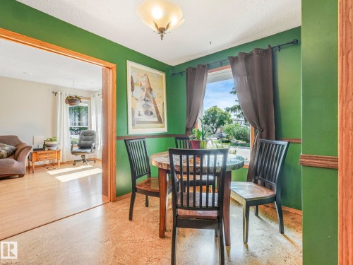 Dining area with baseboards and a textured ceiling - 3608 15 Avenue, Edmonton, AB - Indoor Photo Showing Dining Room