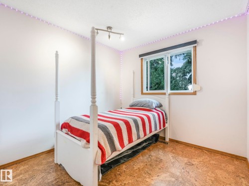 Bedroom featuring baseboards and a textured ceiling - 3608 15 Avenue, Edmonton, AB - Indoor Photo Showing Bedroom
