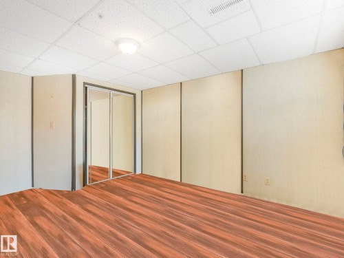 Unfurnished bedroom featuring a paneled ceiling and a closet - 3608 15 Avenue, Edmonton, AB - Indoor