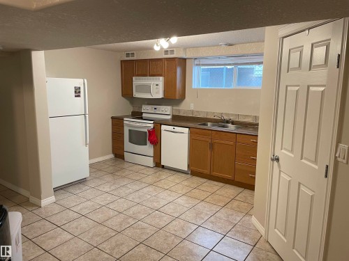9426/9428 96A Street, Edmonton, AB - Indoor Photo Showing Kitchen With Double Sink