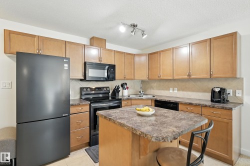 212 11615 Ellerslie Road Sw, Edmonton, AB - Indoor Photo Showing Kitchen With Double Sink