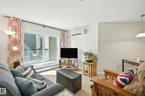 212 11615 Ellerslie Road Sw, Edmonton, AB - Indoor Photo Showing Living Room