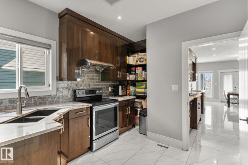 1507 Adamson View Sw, Edmonton, AB - Indoor Photo Showing Kitchen With Double Sink