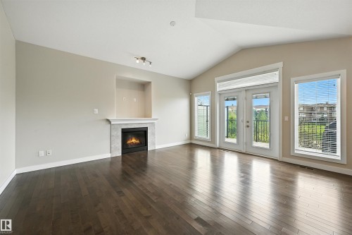 14 3090 Cameron Heights Way, Edmonton, AB - Indoor Photo Showing Living Room With Fireplace
