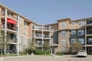 230 6076 Schonsee Way Nw, Edmonton, AB  - Outdoor With Balcony With Facade 