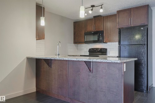 230 6076 Schonsee Way Nw, Edmonton, AB - Indoor Photo Showing Kitchen