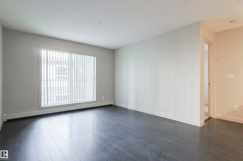 230 6076 Schonsee Way Nw, Edmonton, AB - Indoor Photo Showing Other Room
