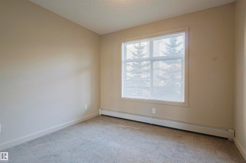 230 6076 Schonsee Way Nw, Edmonton, AB - Indoor Photo Showing Other Room