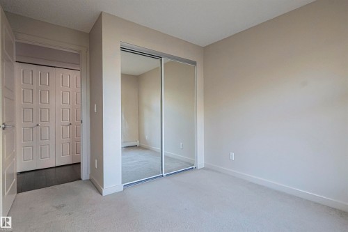 230 6076 Schonsee Way Nw, Edmonton, AB - Indoor Photo Showing Other Room