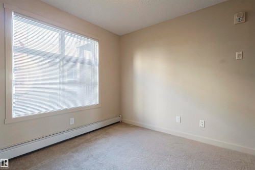 230 6076 Schonsee Way Nw, Edmonton, AB - Indoor Photo Showing Other Room
