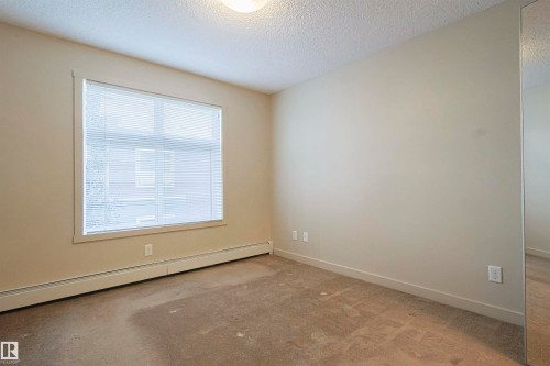 230 6076 Schonsee Way Nw, Edmonton, AB - Indoor Photo Showing Other Room