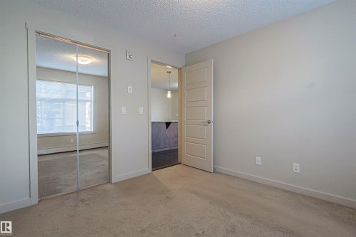 230 6076 Schonsee Way Nw, Edmonton, AB - Indoor Photo Showing Other Room