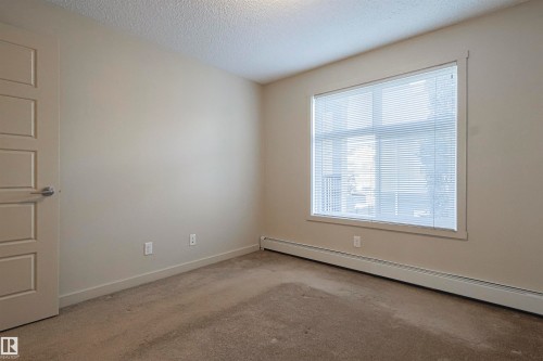 230 6076 Schonsee Way Nw, Edmonton, AB - Indoor Photo Showing Other Room