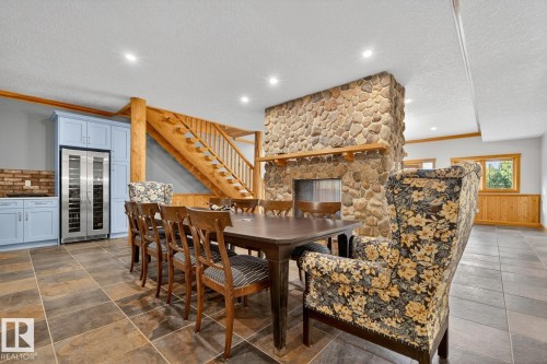 16 52111 Rge Road 25, Rural Parkland County, AB - Indoor Photo Showing Dining Room With Fireplace