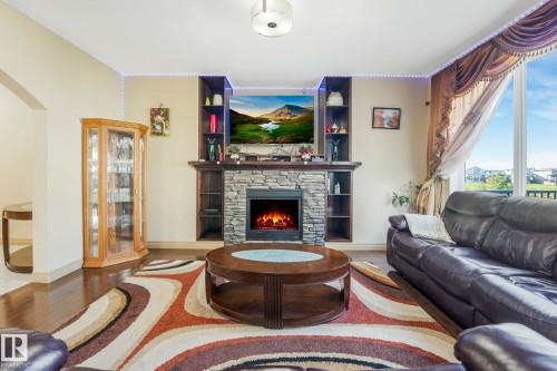 1238 Secord Landing Landing, Edmonton, AB - Indoor Photo Showing Living Room With Fireplace