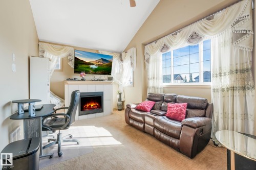 1238 Secord Landing Landing, Edmonton, AB - Indoor Photo Showing Other Room With Fireplace