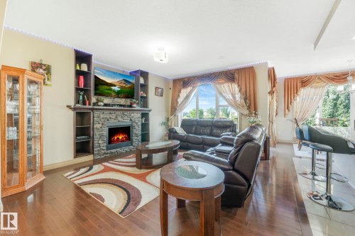 1238 Secord Landing Landing, Edmonton, AB - Indoor Photo Showing Living Room With Fireplace