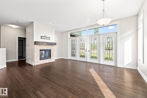 63 18343 Lessard Road, Edmonton, AB - Indoor Photo Showing Living Room With Fireplace