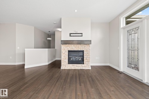 63 18343 Lessard Road, Edmonton, AB - Indoor Photo Showing Living Room With Fireplace