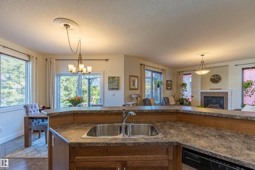 9 Southbridge Crescent, Calmar, AB - Indoor Photo Showing Kitchen With Fireplace With Double Sink