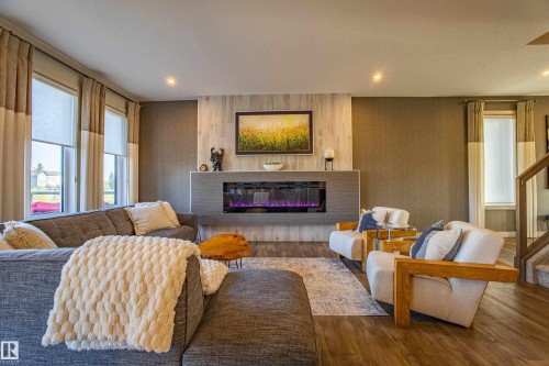 6013 Naden Landing Landing, Edmonton, AB - Indoor Photo Showing Living Room With Fireplace