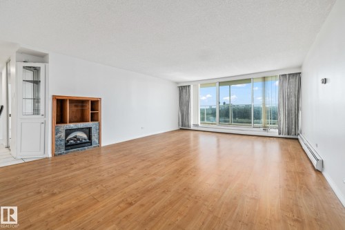802 11920 100 Avenue, Edmonton, AB - Indoor Photo Showing Living Room With Fireplace