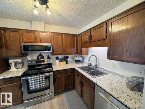 2419 142 Avenue, Edmonton, AB - Indoor Photo Showing Kitchen With Double Sink