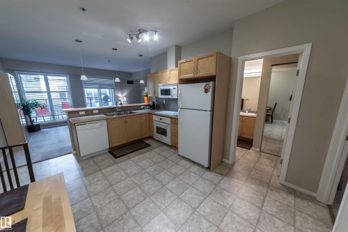 150 4827 104A Street, Edmonton, AB - Indoor Photo Showing Kitchen With Double Sink