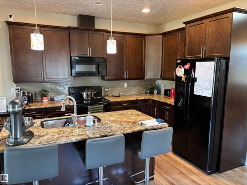 4804 53 Avenue, Elk Point, AB - Indoor Photo Showing Kitchen With Double Sink