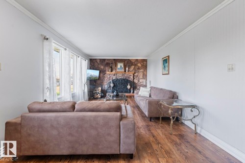 25 46302 Twp Rd 611, Rural Bonnyville M.D., AB - Indoor Photo Showing Living Room With Fireplace