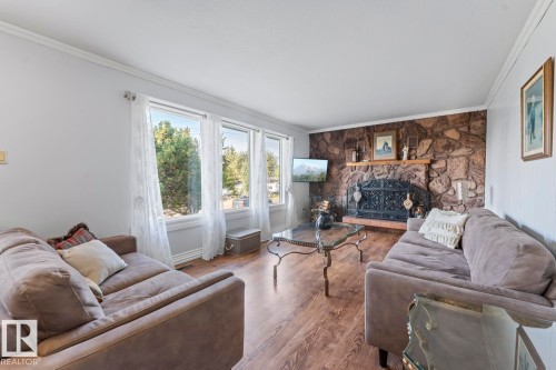 25 46302 Twp Rd 611, Rural Bonnyville M.D., AB - Indoor Photo Showing Living Room With Fireplace