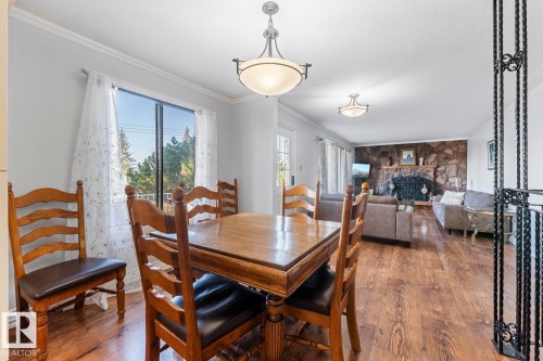 25 46302 Twp Rd 611, Rural Bonnyville M.D., AB - Indoor Photo Showing Dining Room With Fireplace