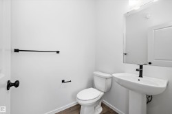 Bathroom featuring baseboards and dark wood-type flooring - 